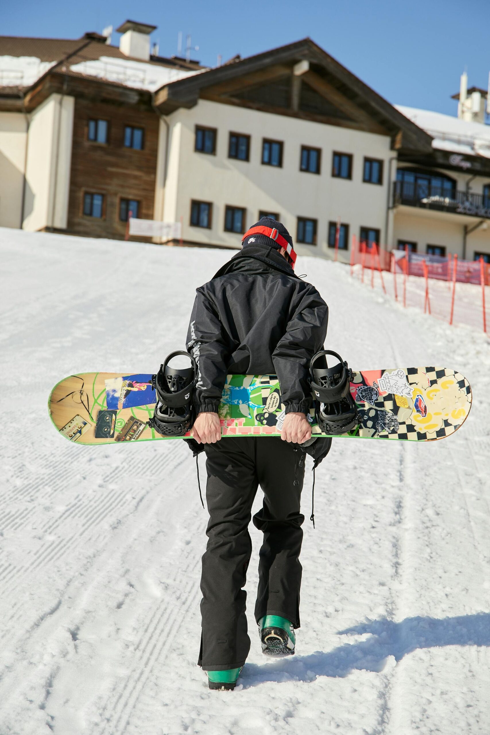 A Man Carrying a Snowboard